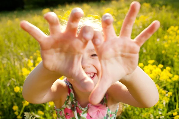 Little girl plays the fool — Stock Photo, Image