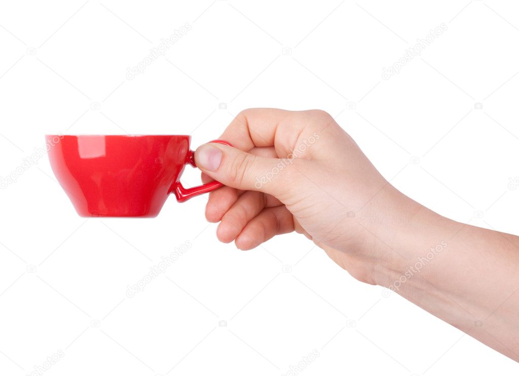 Red porcelain cup with coffee in hand
