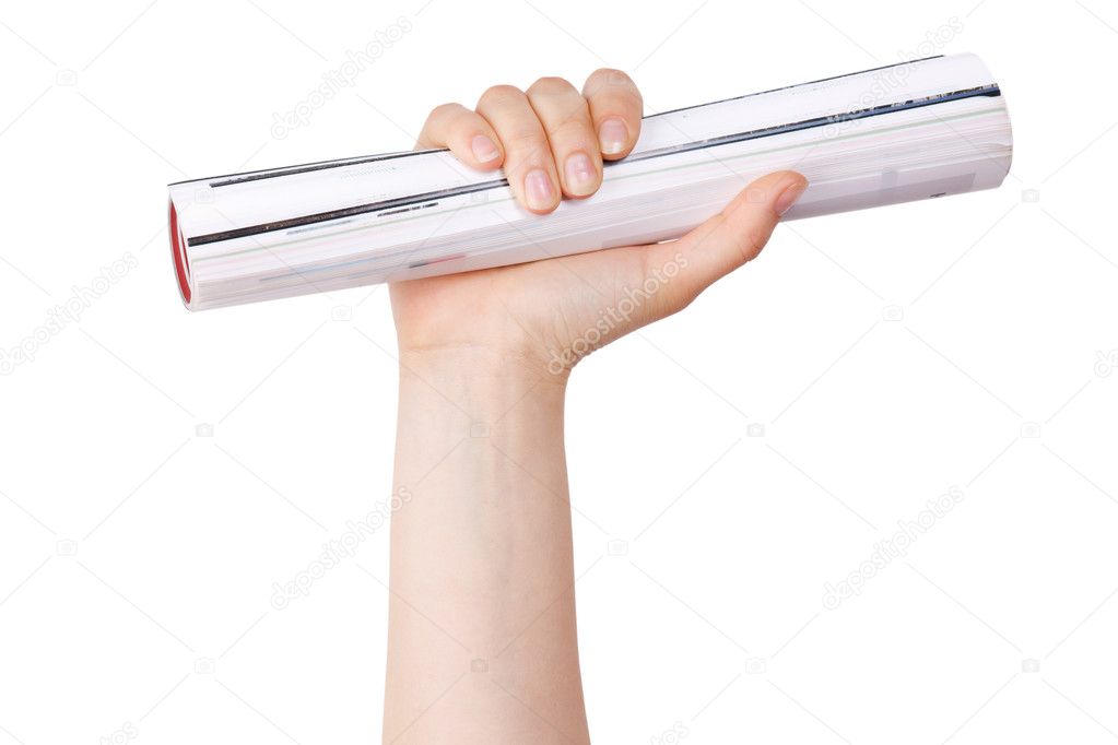 Human hand holds a rolled journal