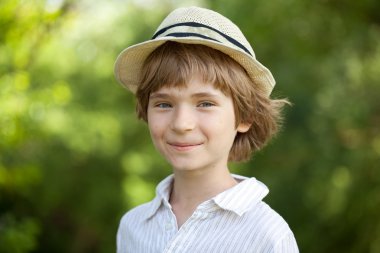 Smiling boy in the striped shirt clipart