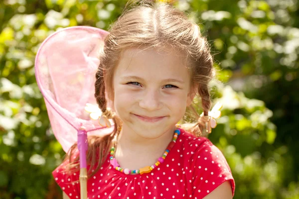 Smiling girl with a butterfly net — Stock Photo, Image