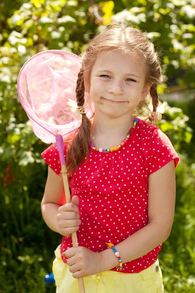 Smiling girl with a pink butterfly net — Stock Photo, Image