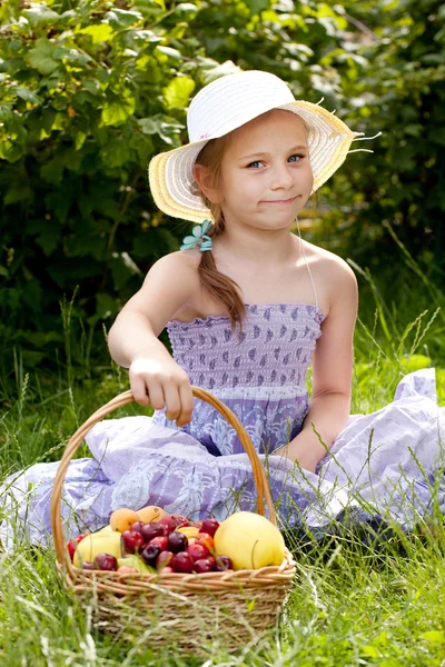 Happy girl with a basket — Stock Photo, Image