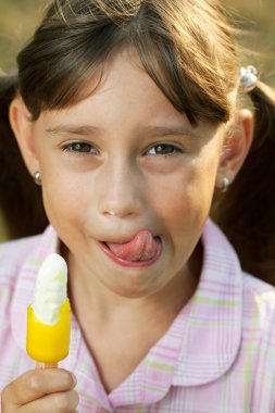 Pretty girl eating ice cream clipart