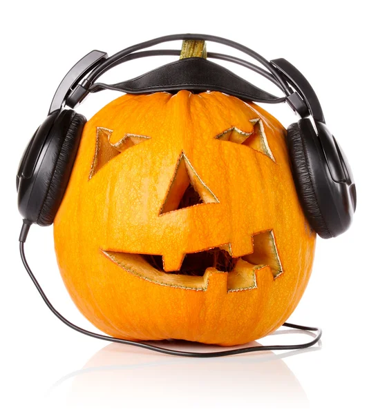 Halloween Pumpkin.Scary Jack O 'Lantern em fones de ouvido — Fotografia de Stock