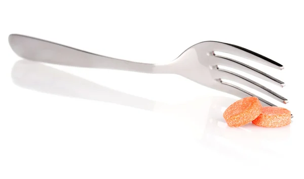 Comprimido laranja com garfo — Fotografia de Stock