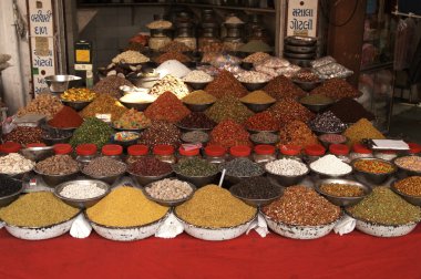 Indian Market Stall Selling Nuts and Spices clipart