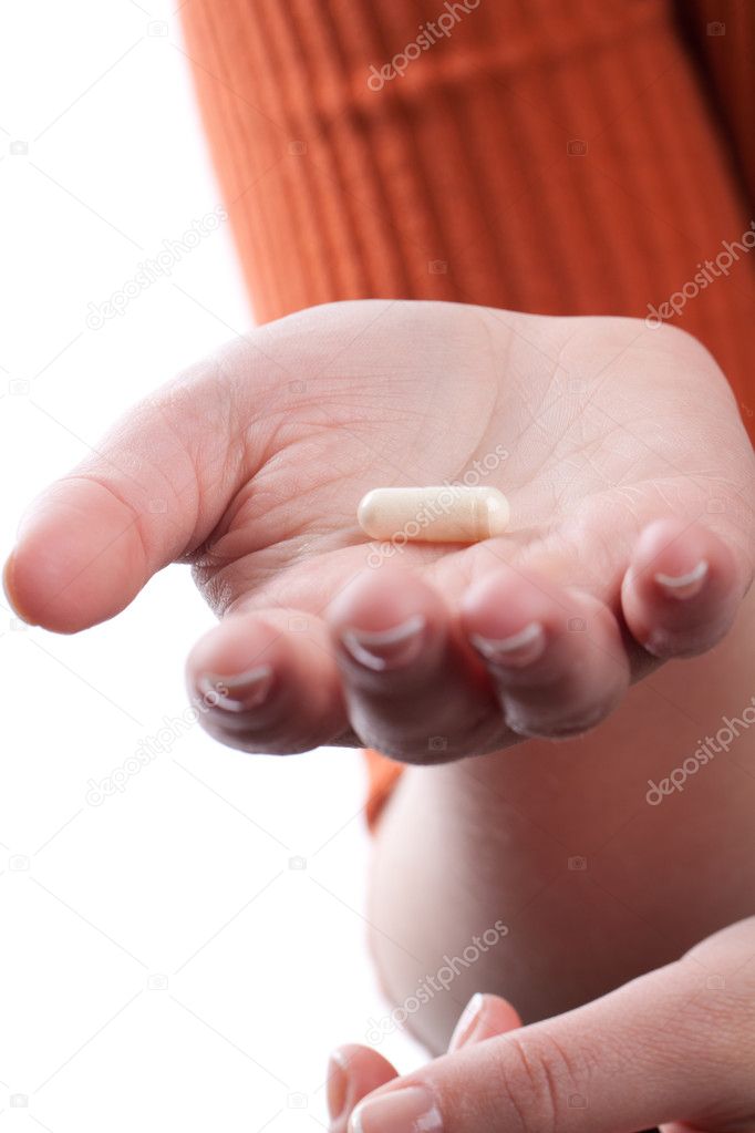 Woman hand holding pills
