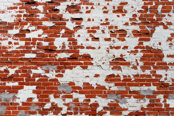 Grungy parede de tijolo com pintura de descascamento — Fotografia de Stock