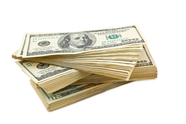 Haldy dolarové bankovky na bílém pozadí — Stock fotografie