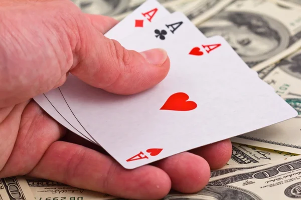 Show three ace on a money background — Stock Photo, Image