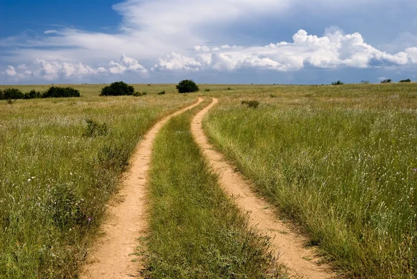 Ground road in a steppe — Stock Photo, Image