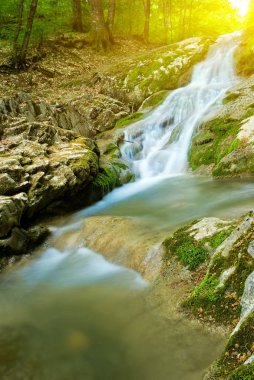 Canyon river in a rays of sun clipart