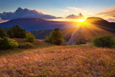 Evening scene in a mountains clipart