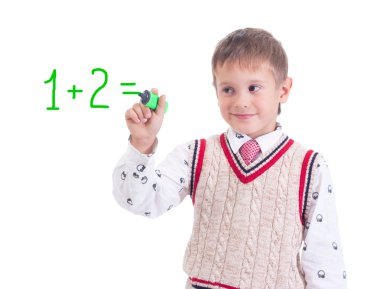 A young boy child is writing out math and science equations and formulas. clipart