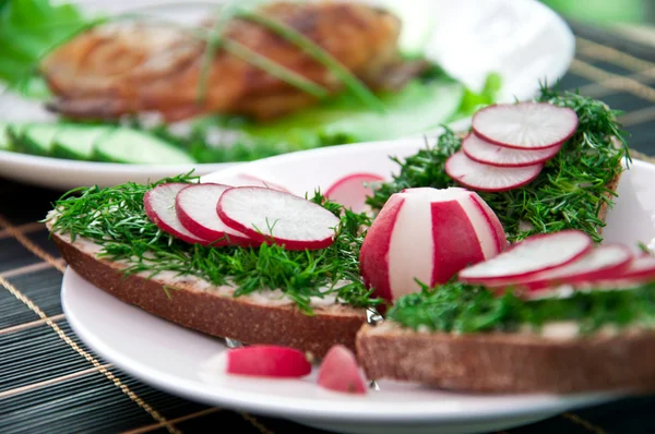 Sandwich with greens and radishes — Stock Photo, Image