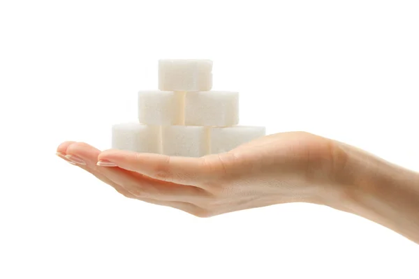 Жіноча рука з кубиками цукру — стокове фото