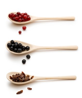 Three spoon with raisin, chokeberry and cranberries clipart