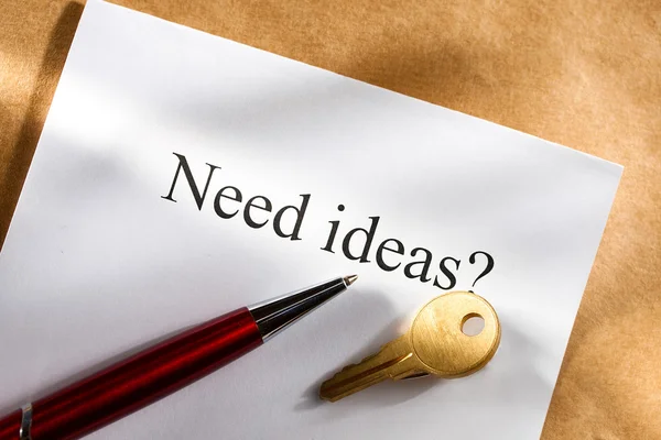 Idea conception with key and pen — Stock Photo, Image