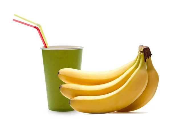 Paper cup with straws and bananas — Stock fotografie