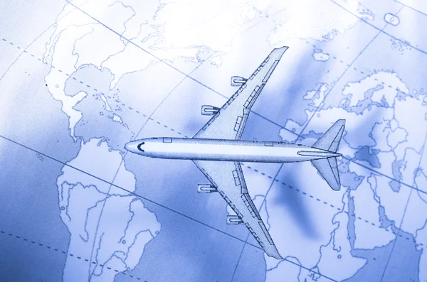 stock image Airplane above the map in blue