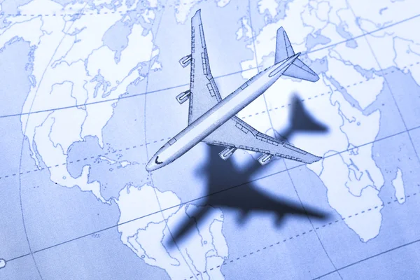 stock image Airplane above the map in blue