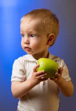 Child with a green apple