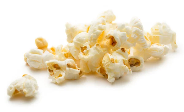Popcorn på den vita bakgrunden — Stockfoto