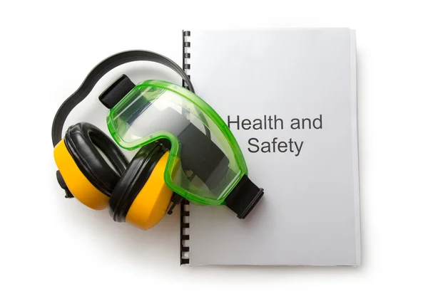 Zdraví a bezpečnosti registr s brýle a sluchátka — Stock fotografie