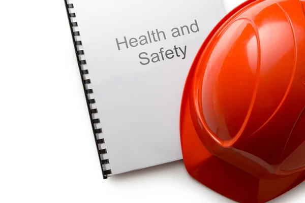 Health and safety register with helmet — Stock Photo, Image