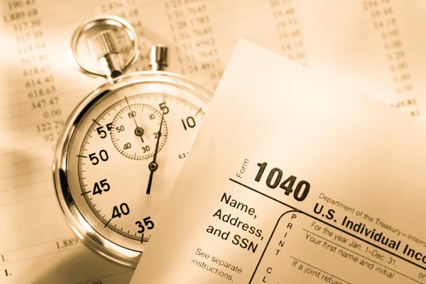 Tax form, operating budget and stopwatch — Stock Photo, Image