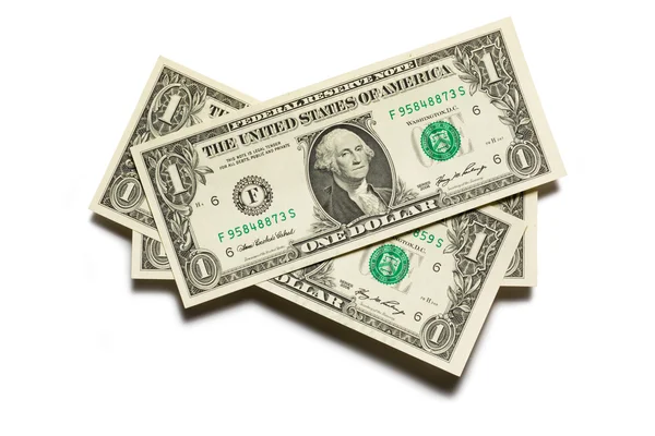 Банкноты в долларах на белом — стоковое фото