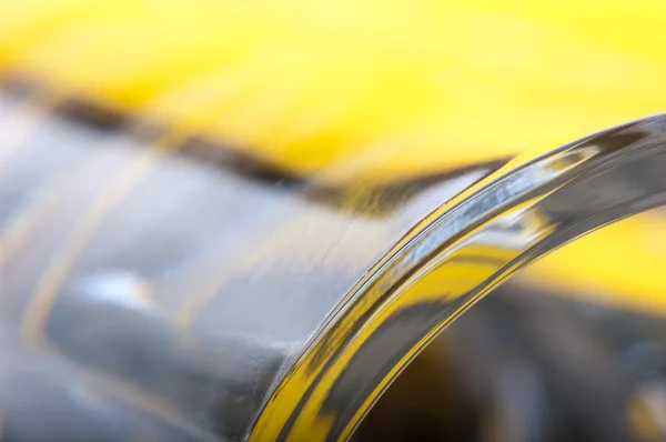 stock image Smooth glass yellow abstraction of two colors.