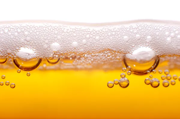 Espuma e bolhas de cerveja . Imagem De Stock