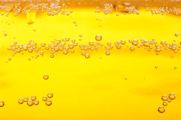 Thousands of small bubbles in beer. — Stock Photo, Image