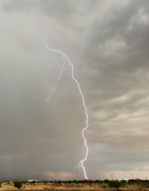 A Lightning Bolt Strikes a Neighborhood House clipart
