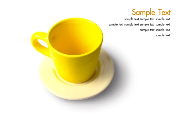 En tom gul kopp med platta — Stockfoto