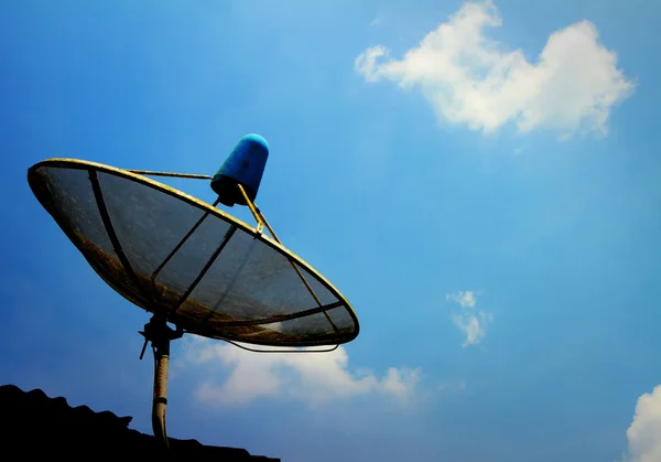 A small black satellite dish on roof — Stock Photo, Image