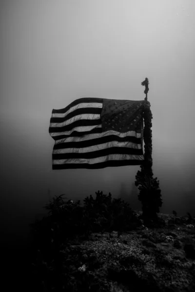 stock image American flag on a shipwreck in key largo, florida