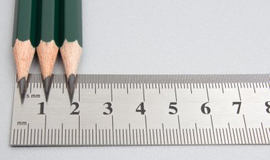 Close up metal ruler and pencil clipart