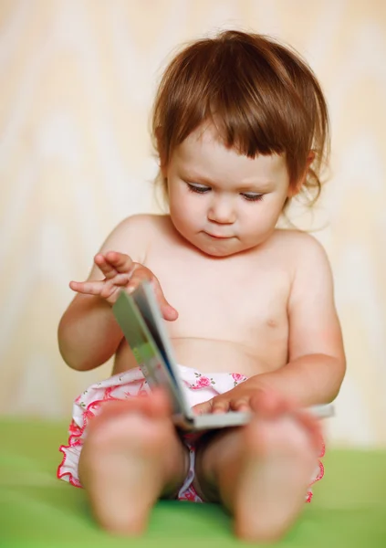 Happy baby with the book — Stock Photo, Image