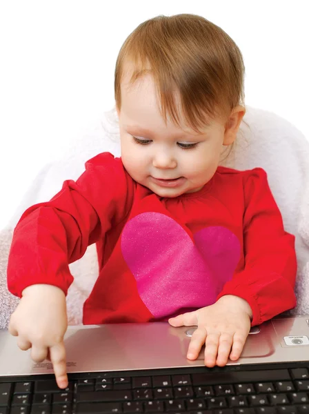 Cute baby girl holding laptop — Stock Photo, Image