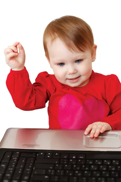 Cute baby girl holding laptop — Stock Photo, Image