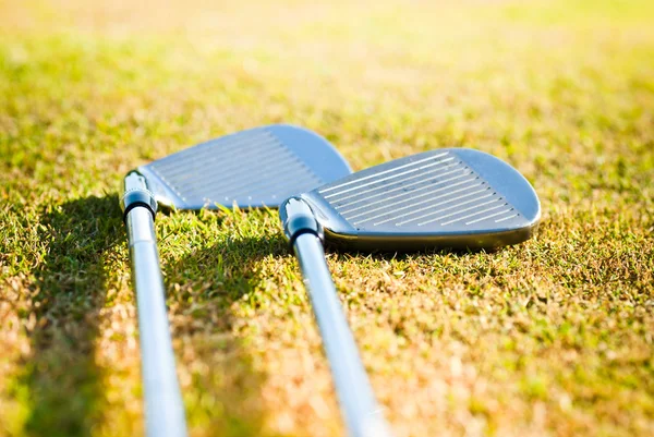 stock image Golf clubs on grass