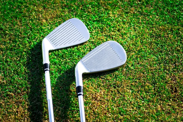 stock image Golf clubs on grass