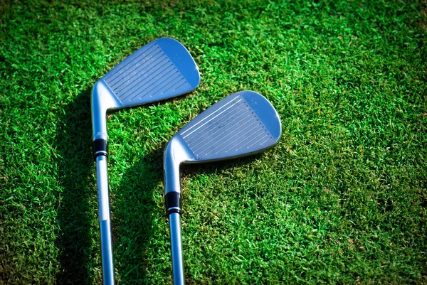 stock image Golf clubs on grass