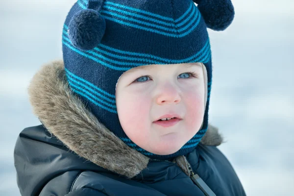 Closeup portrait of a boyin winter clothes with glow — Stock Photo, Image