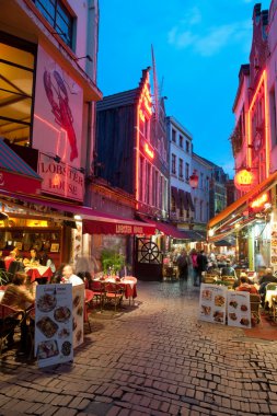 Small cafe on the old streets of Brussels clipart