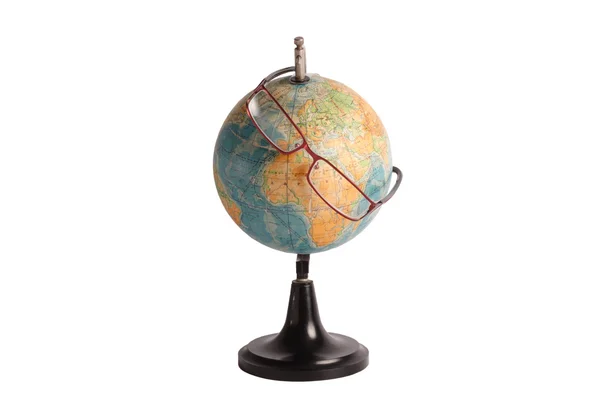 stock image Globe looking through the glasses