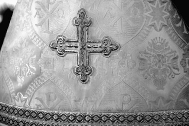 The cross on the clothes of an Orthodox priest clipart